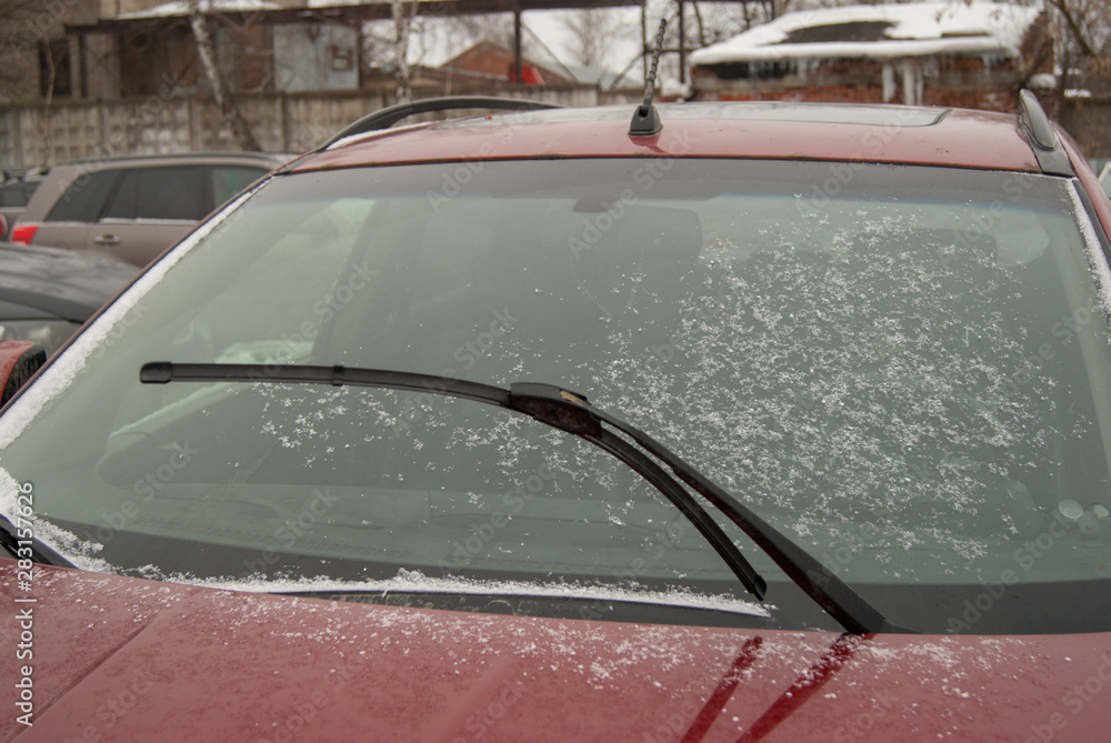 Car windshield wiper standing straight. Lifted car wiper. Car roof