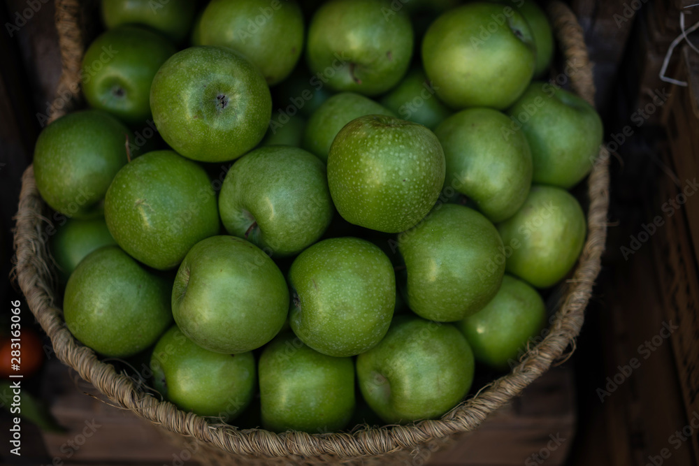 Stall at farmers fresh food market. Ripe organic apples in a basket. Freshly, seasonal harvested fruits. Agriculture products. Stall at farmers fresh food market. Ripe organic apples in a basket. Freshly, seasonal harvested fruits. Agriculture products.