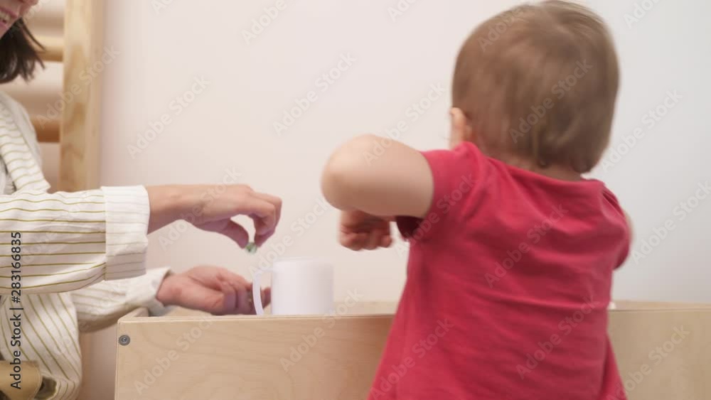 Close-up demonstration video of the infants development games. Sensory playful exercises. Early creativity brain development concept. Close-up demonstration video of the infants development games. Sensory playful exercises. Early creativity brain development concept.