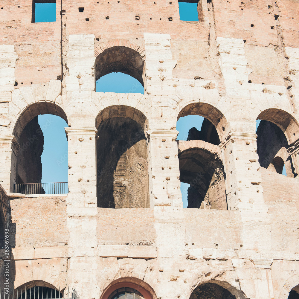 Fragment of a wall with arched windows of Great Colosseum. Rome, Italy.