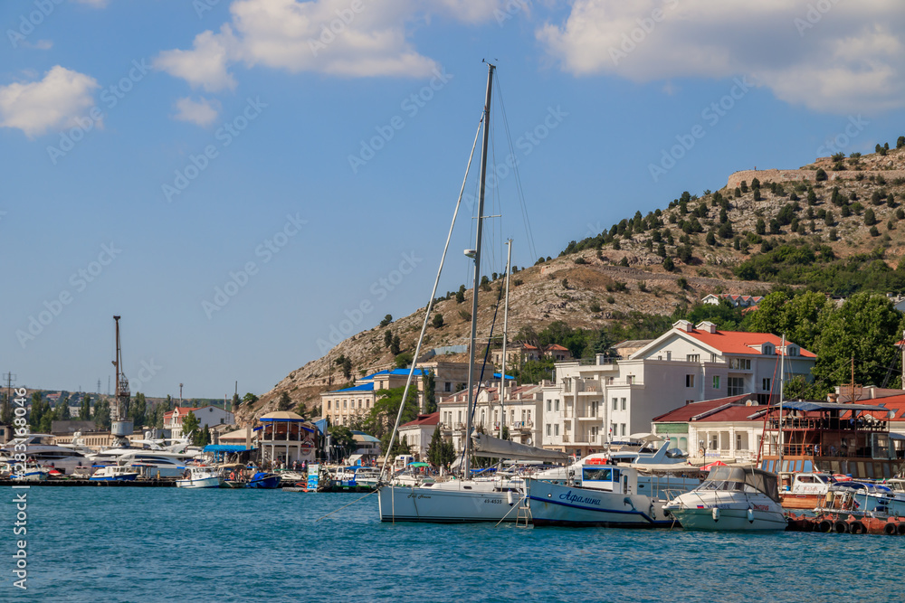 Balaklava bay in summer in sunny weather. Crimea, Russia. A lot of boats and ships. Bay for boats.