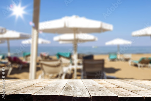 desk of free space and beach background 