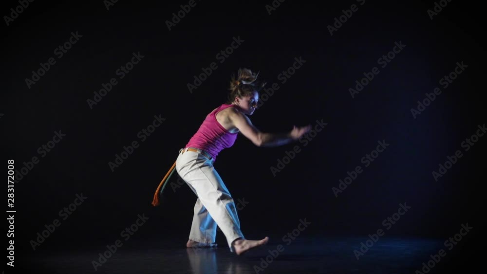 Maiden performing incredibly complex of martial art of capoeira. Slow motion. Maiden performing incredibly complex of martial art of capoeira. Slow motion.