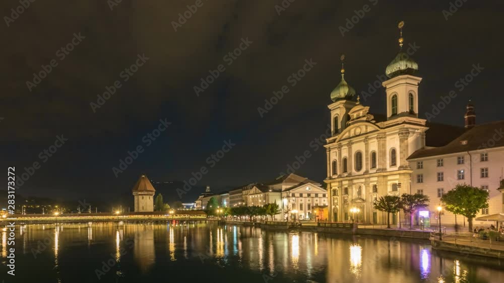 Lucerne (Luzern) Switzerland time lapse 4K, city skyline night timelapse at Chapel Bridge and Jesuit Church Lucerne (Luzern) Switzerland time lapse 4K, city skyline night timelapse at Chapel Bridge and Jesuit Church