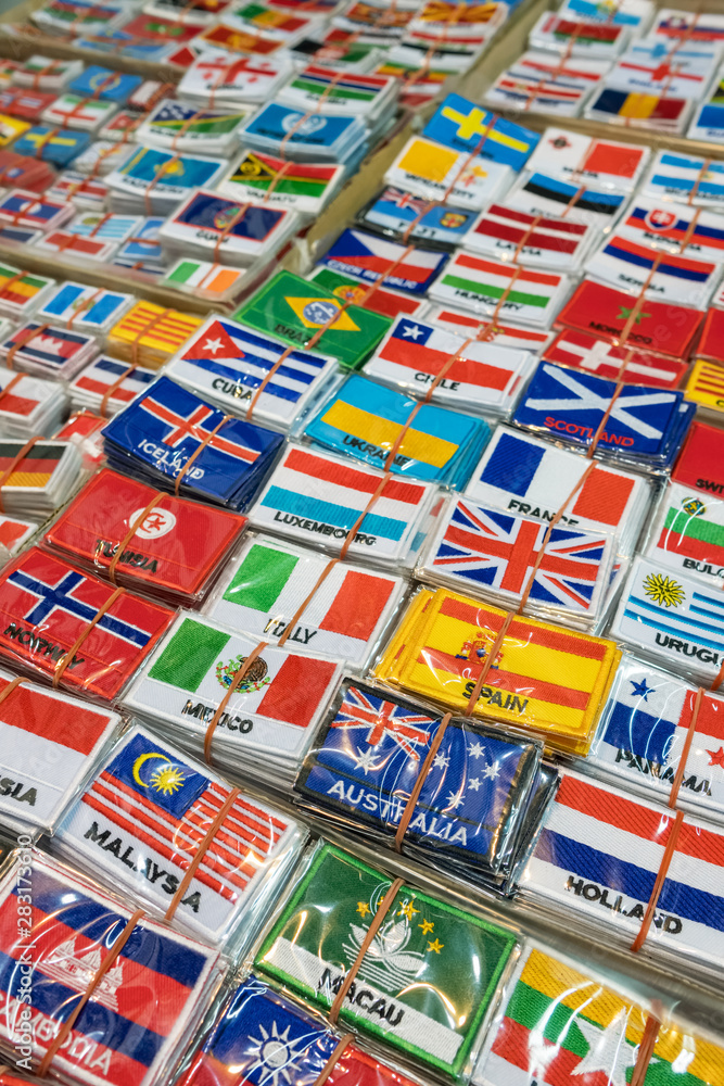 Bunch of patches with world country flags. Embroidered flags background
