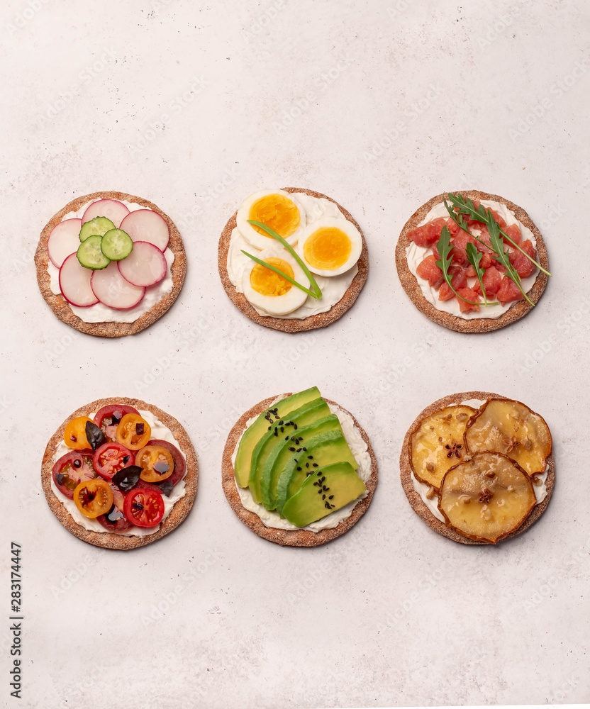 crostini with different toppings on a light background crostini with different toppings on a light background