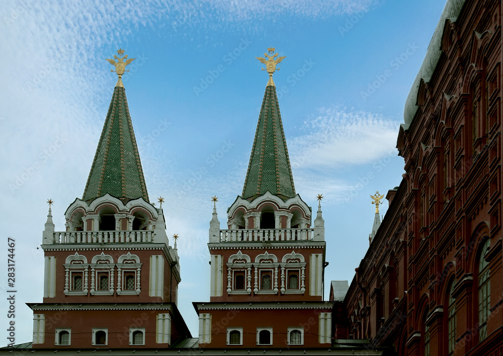 Towers of the Resurrection (Iversky) Gate on Red Square against the background of the summer sky. Moscow, Russia. Towers of the Resurrection (Iversky) Gate on Red Square against the background of the summer sky. Moscow, Russia.