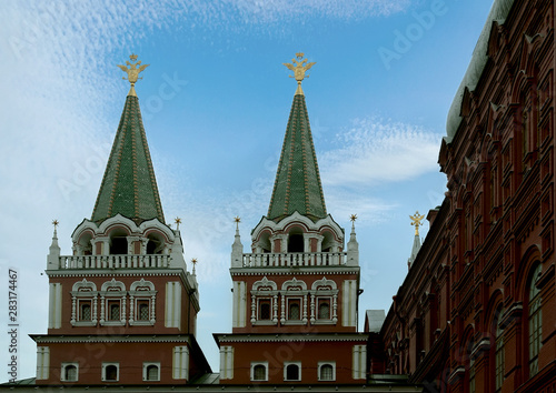 Towers of the Resurrection (Iversky) Gate on Red Square against the background of the summer sky. Moscow, Russia.