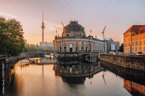Museum Island on Spree river and tower at background at sunrise in Berlin