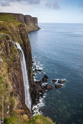 Kilt rock with the Mealt falls at the Isle of Skye in the Highlands of Scotland