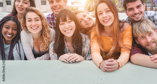 Obraz na plátně Happy millennial friends from diverse cultures and races having fun posing in fr