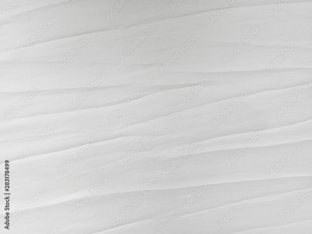 Soft white wrinkled fabric background Soft white wrinkled fabric background