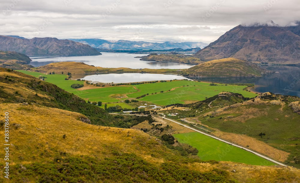 A view Lake Wanaka and the surronding hills and lakes taken from the top of the Diamond Lake trail.