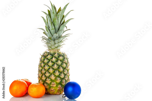Pineapple, tangerines, Christmas toy on a white background