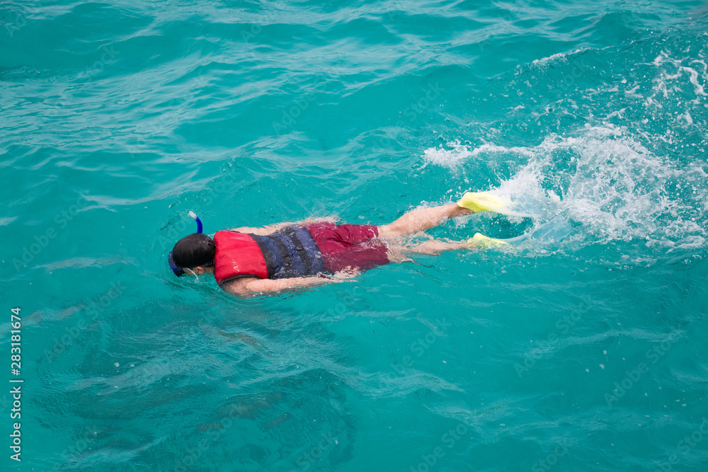 Tourist snorkeling in Red Sea paradise