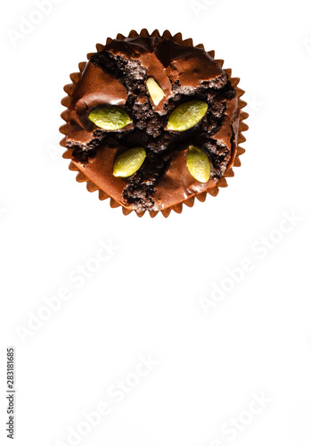 Chocolate muffins with almond nuts placed on a white background above