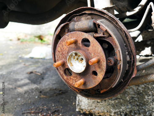 Close-up photos of car wheels that are rusted in the car cemetery.