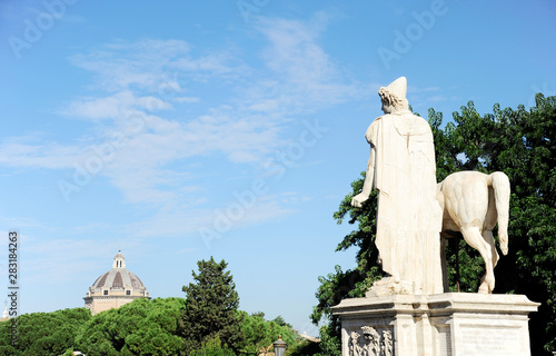 Statue of Castor (Castore) one of the two dioscuri (Polydeuces), and horse. From here the Rome view. Rome, Italy photo