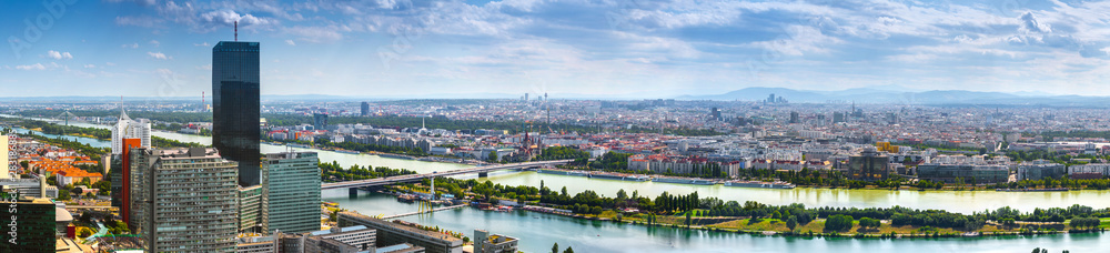 Stunning aerial panoramic cityscape view austrian capital city of Vienna.  Modern glass-concrete skyscrapers in the ancient city on the banks the Danube -of the largest river in Europe. Hot summer day