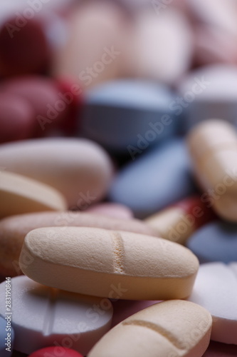 multicolored pills, healthcare and medicine
