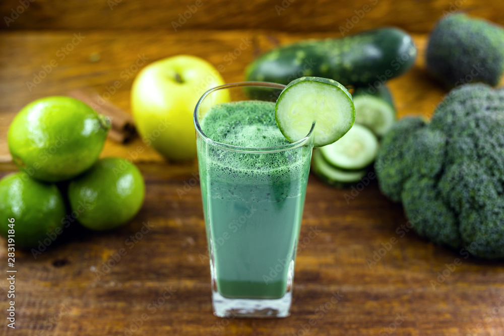 Green detox juice, kale leaves, lemon, apple, lettuce, cucumber, lime and other green vegetables. Copy space. Vegetarian juice, alkaline food concept. Healthy life. Copy space Raw, vegan, vegetarian. Green detox juice, kale leaves, lemon, apple, lettuce, cucumber, lime and other green vegetables. Copy space. Vegetarian juice, alkaline food concept. Healthy life. Copy space Raw, vegan, vegetarian.