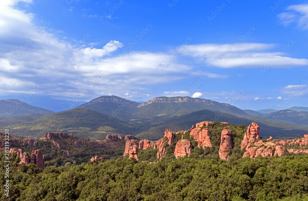 Fototapeta premium Magnificent rocks among the forest in Belogradchik, Bulgaria.