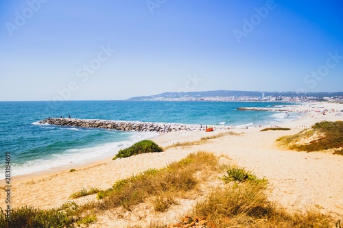 Fototapeta Naklejka Na Ścianę i Meble -  Figueira da foz beach Portugal. Summer day in Europe. Boho style coloured style photo.  Over processed.