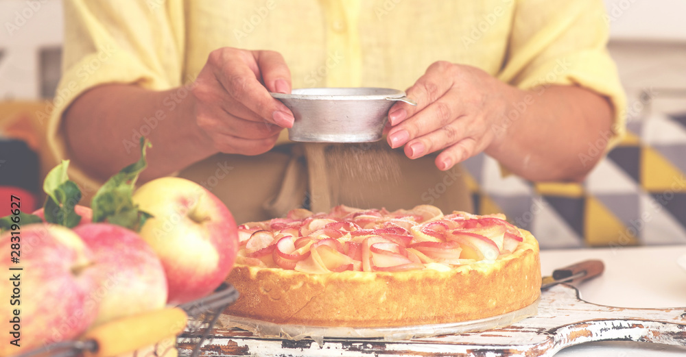 Woman make homemade apple pie. Confectioner make dessert. Apples on the table. Summer fruit dessert. Process of cooking apple pie, top view. Cooking and home concept.