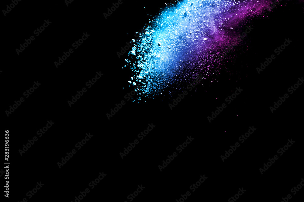 Obraz premium Explosion of colored powder isolated on black background. Abstract colored background. holi festival.