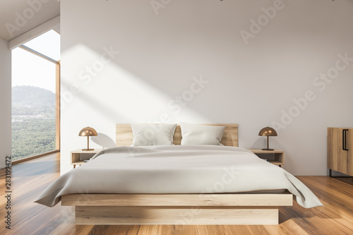 Stylish white attic bedroom interior