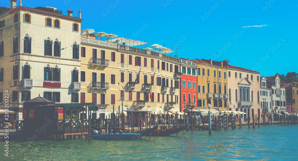 Fototapeta premium Beautiful view of the traditional water channel in Venice in the morning. View on canal with motor boats water. Picturesque landscape.