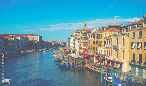 Beautiful view of the traditional water channel in Venice in the morning. View on canal with motor boats water. Picturesque landscape.