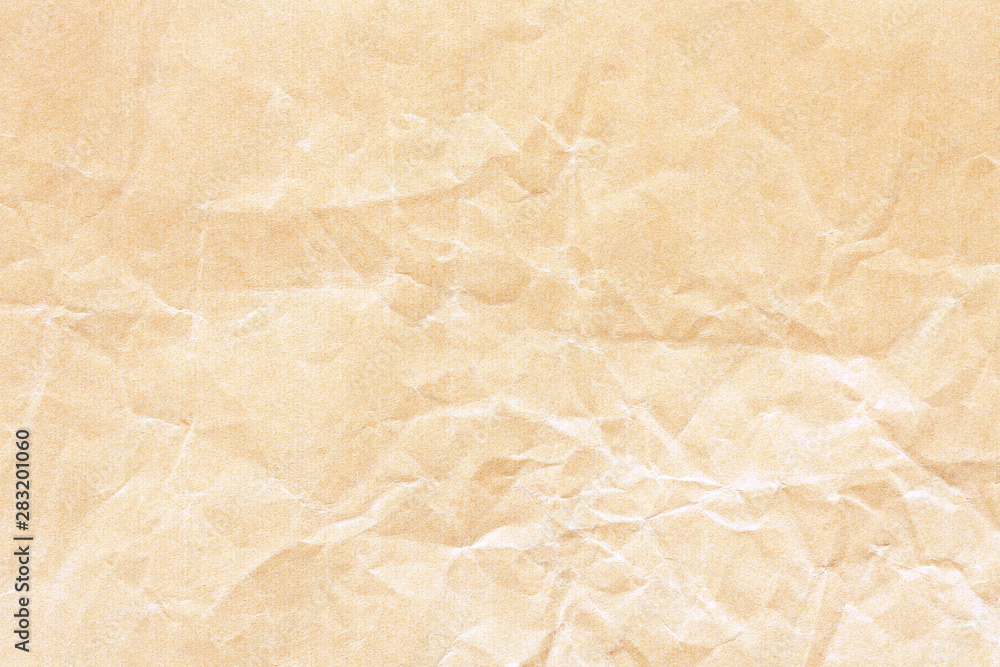 Obraz premium Old brown crumpled Kraft paper background texture