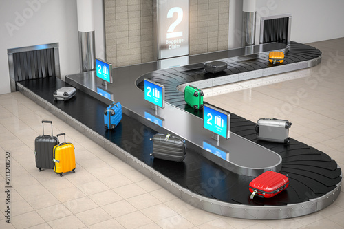Baggage claim in airport terminal. Suitcases on the airport luggage conveyor belt.