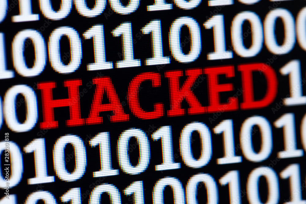 Red inscription HACKED in binary code of ones and zeros. Cyber attack electronic devices. Red inscription HACKED in binary code of ones and zeros. Cyber attack electronic devices.