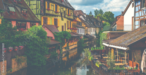 Traditional Alsatian half-timbered houses city Colmar in Alsace. Canal of Colmar, most famous town of Alsace at spring day, France