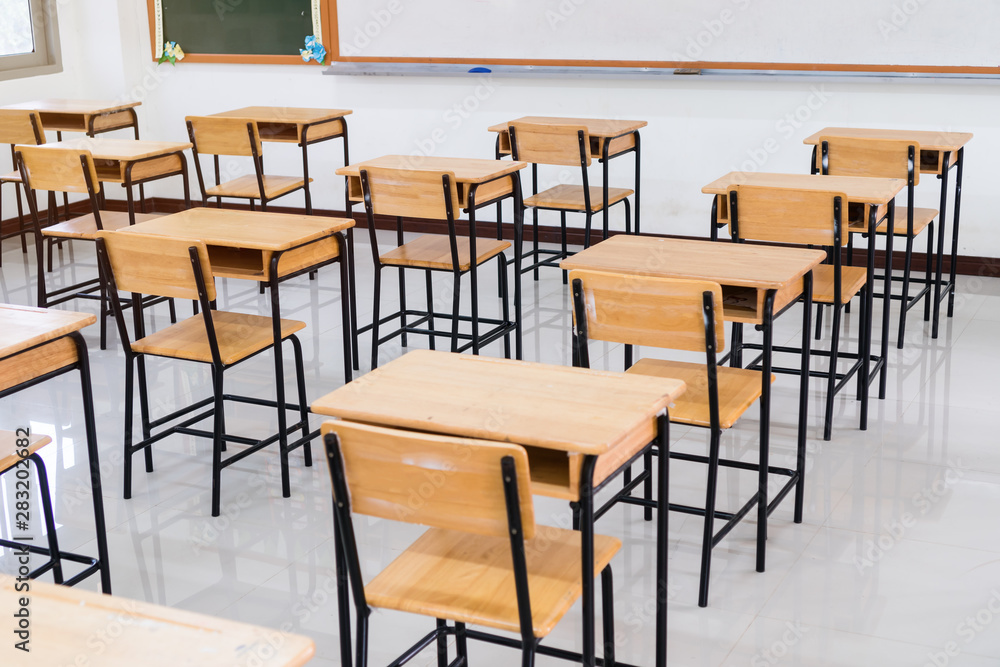 School empty classroom or lecture room interior with desks chair iron wooden whiteboard for studying lessons of secondary education in high school thailand. Learning and Back to school concept