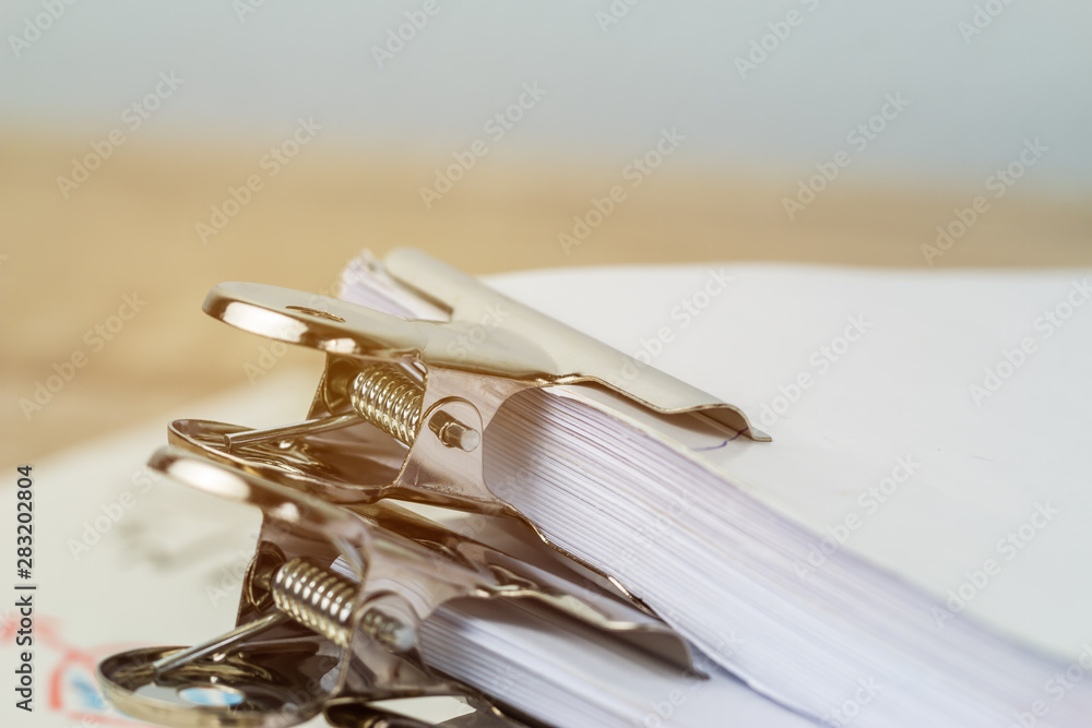 Silver clips paper stacks of piles unfinished papers documents files in accounting business report on desk in busy office, Paperwork of financial folder at business workplace concept Silver clips paper stacks of piles unfinished papers documents files in accounting business report on desk in busy office, Paperwork of financial folder at business workplace concept