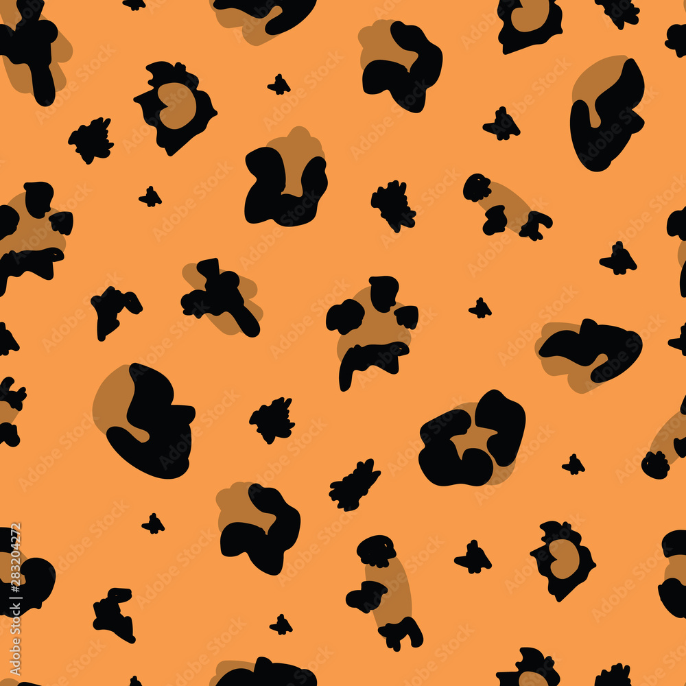 Fototapeta premium Brown leopard print with spots, seamless pattern, background and texture for fabric.