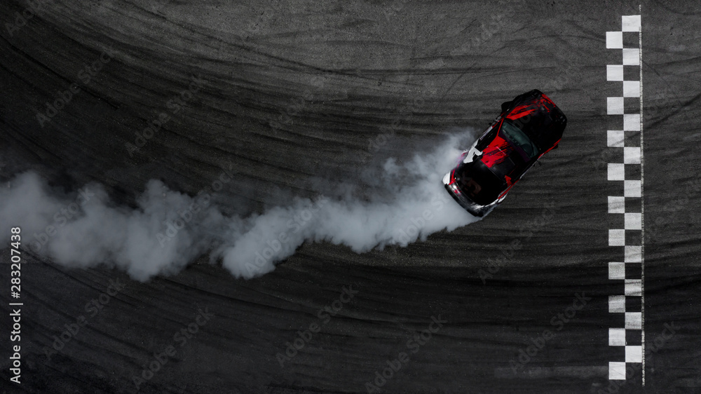 Aerial top view car drifting on asphalt race track with start and finish  line and lots of smoke from burning tires, Auto or automobile background  concept. Stock Photo