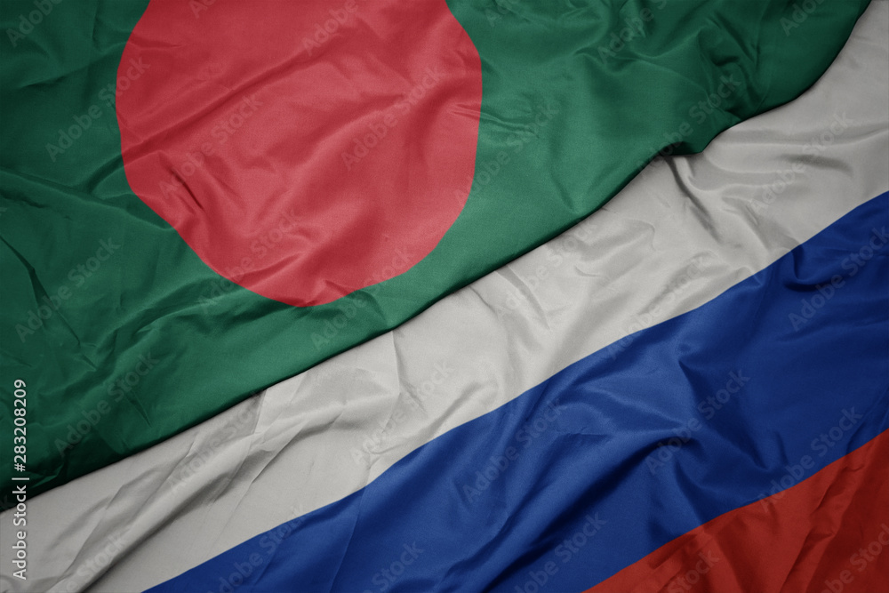 waving colorful flag of russia and national flag of bangladesh.