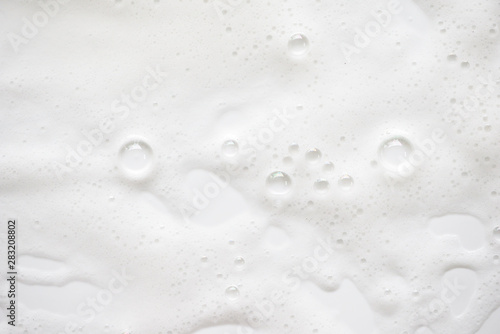 Abstract background white soapy foam texture. Shampoo foam with bubbles