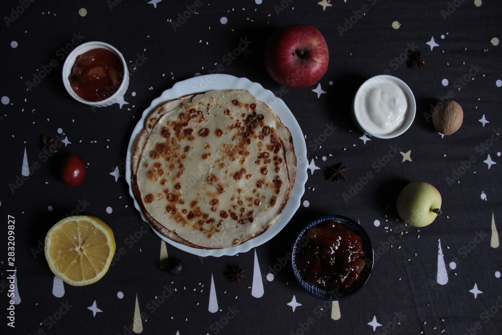 outline of the universe with pancake as Sun and planets as fruits and toppings