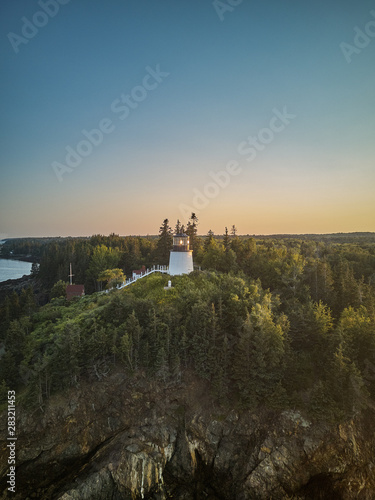 Aerial Drone image of the Owls Head Lighthouse perched on the cliffs at the entrance to Owls Head Harbor on the Maine Coast