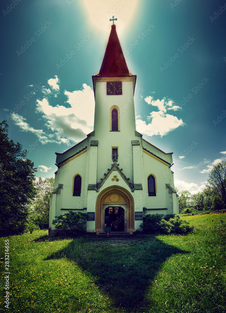 Church Forest Zvonkova.Tower. Beautiful mountain forest landscape with church at sunset.