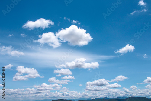 Bright blue sky background and white clouds group pattern floating with breeze on , summer day