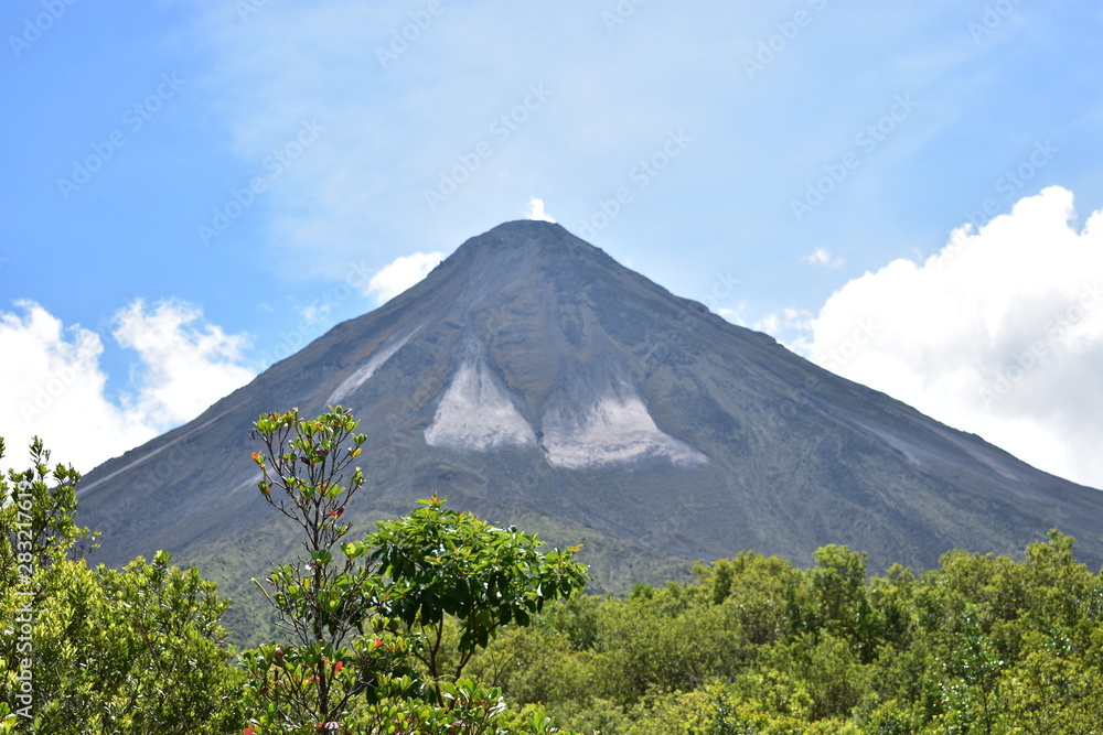 Large Arenal volcano, with green vegetation in the lower area