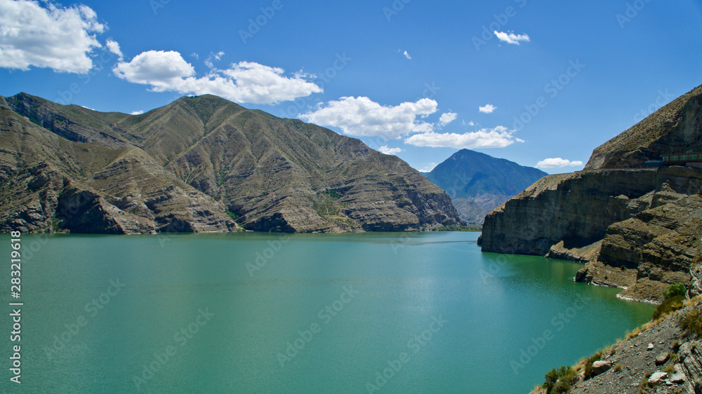 Erzurum, Tortum lake, cliff mountains and cloud reflection in water