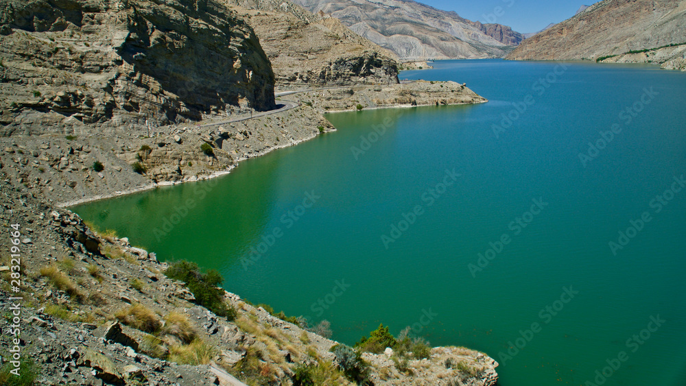Fototapeta premium Erzurum, Tortum lake, cliff mountains and cloud reflection in water