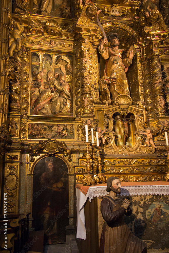 Barcelona, Spain, June 22, 2019: Interior of the Cathedral of Saint Eulalia in Barcelona - gold-plated side altar.